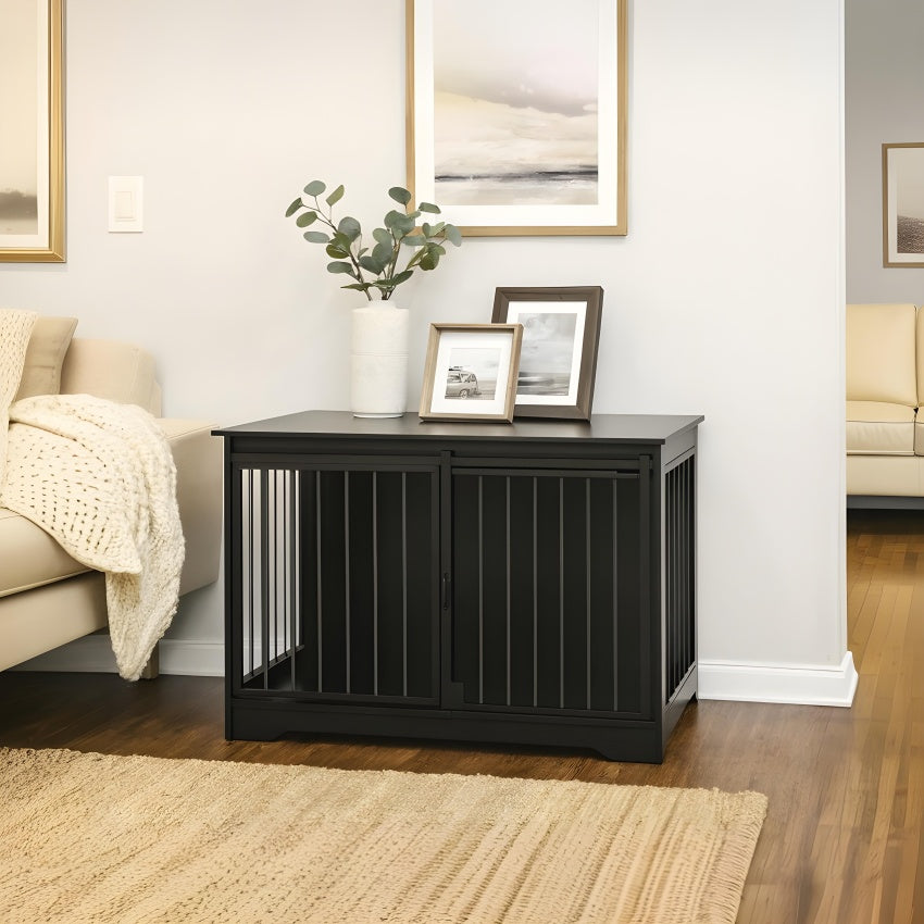 Black pet crate in a living room setting with decor elements.